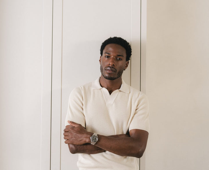 Portrait of a man against a white wall