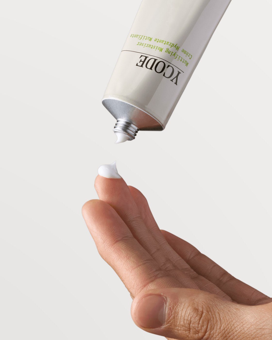 Applying Mattifying Moisturizer