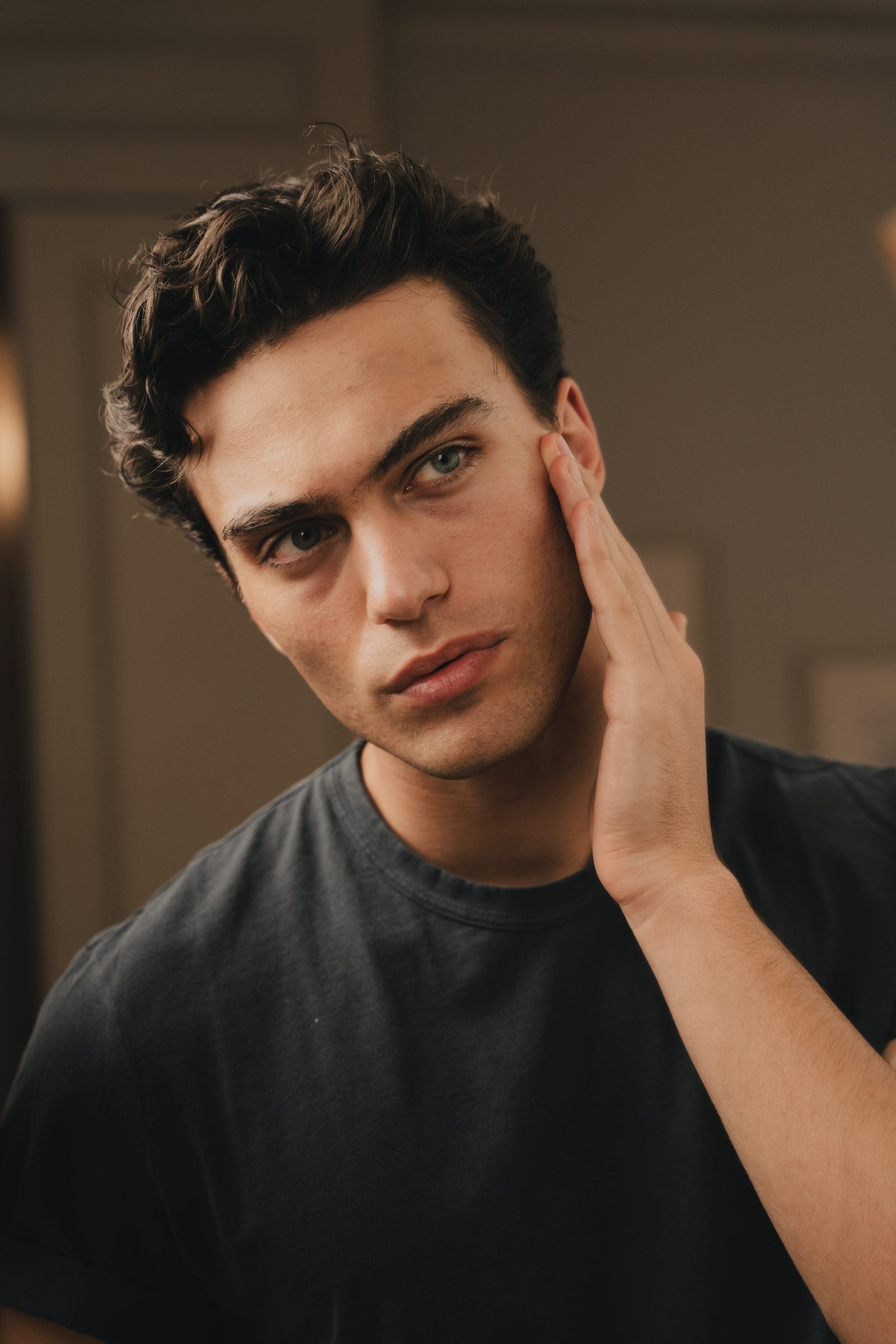 Man in his thirties at home, calm and considered — YCODE anti-ageing skincare for men in their 30s and 40s