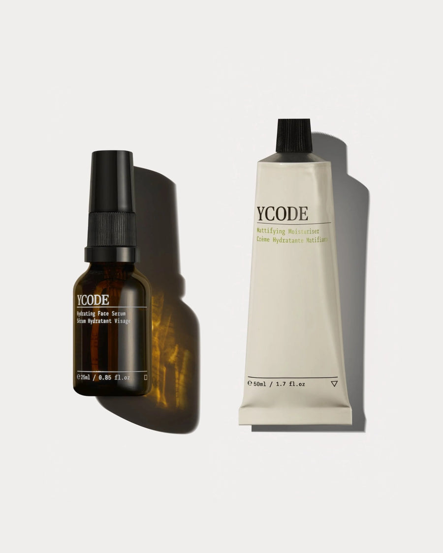 The YCODE Daily Essentials for men, Hydrating Face Serum and Mattifying Moisturiser on a beige background