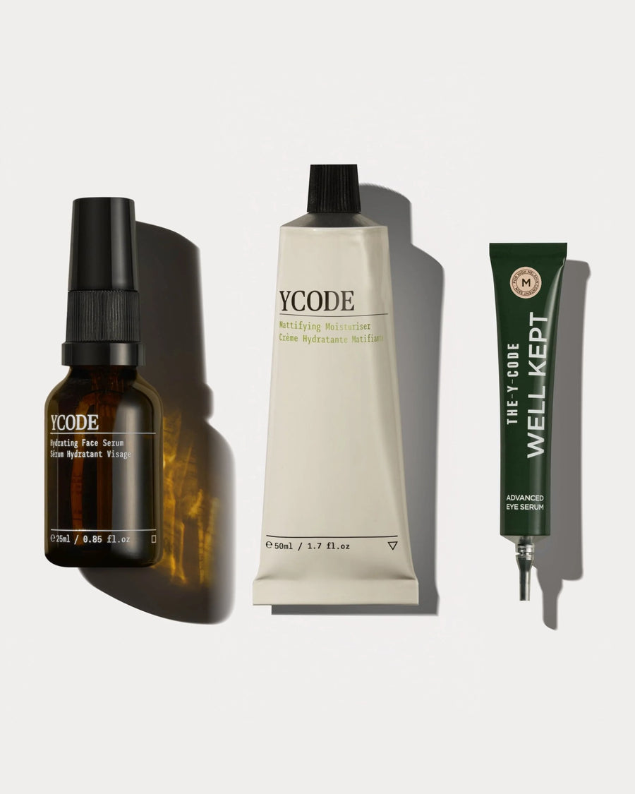 The YCODE Advanced Routine for men, Hydrating Face Serum, Mattifying Moisturiser and Advanced Eye Serum on a beige background