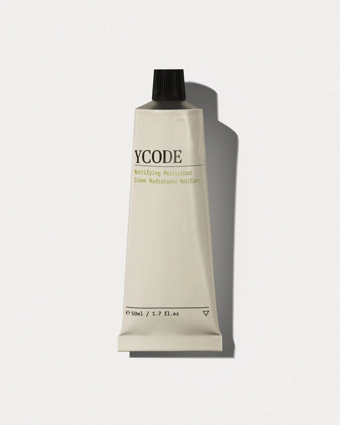 YCODE Mattifying Moisturiser for men, 50ml tube front view on a beige background