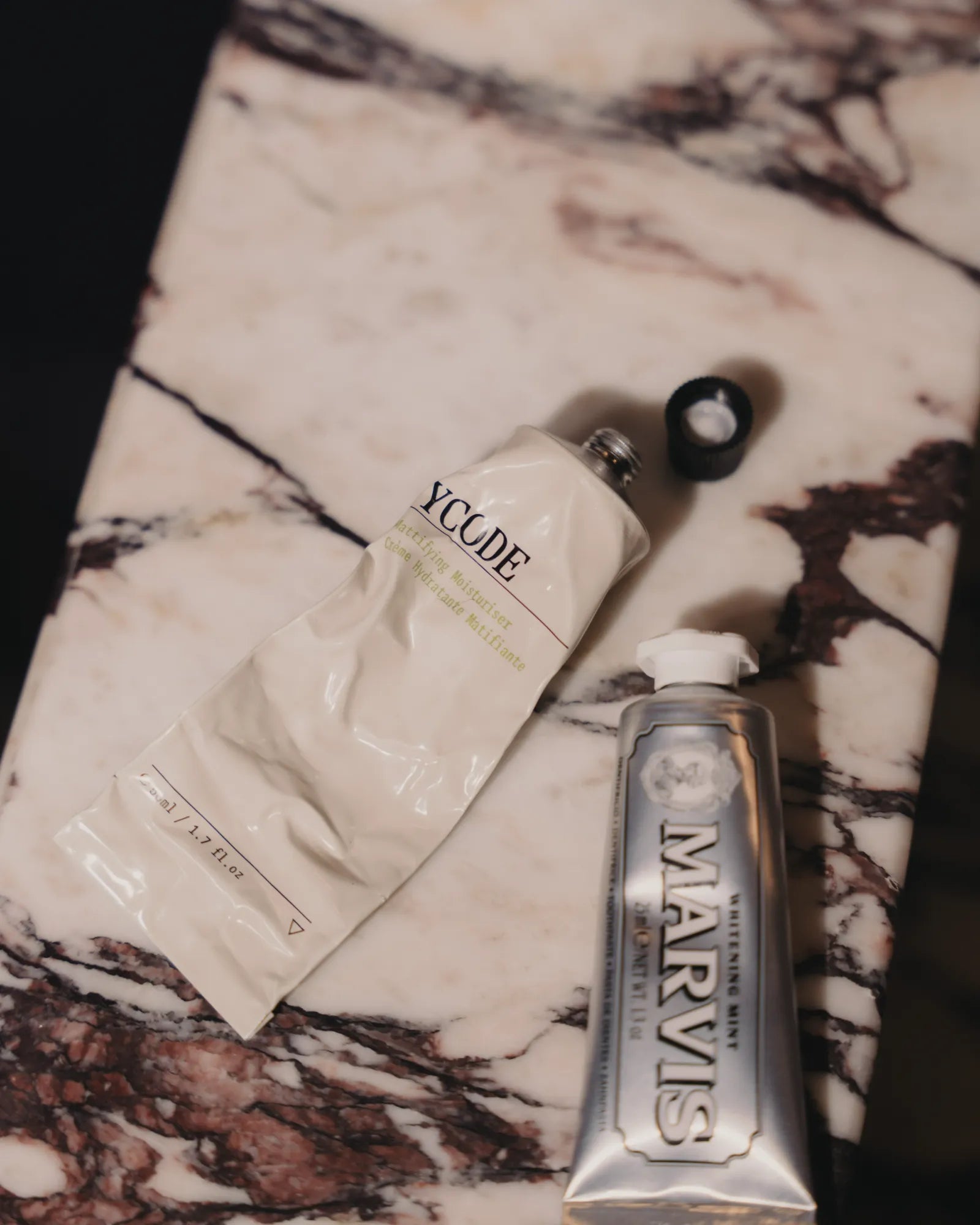 Mattifying Moisturiser at rest on marble